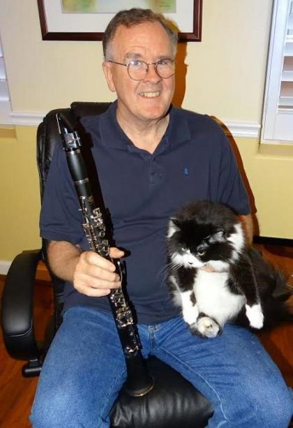 Emersonian Ben Withers with his clarinet and cat