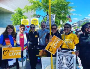 People with Side with Love banner at march