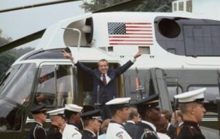 Pres. Richard Nixon resigns, gives victory sign as he leaves by helicopter.